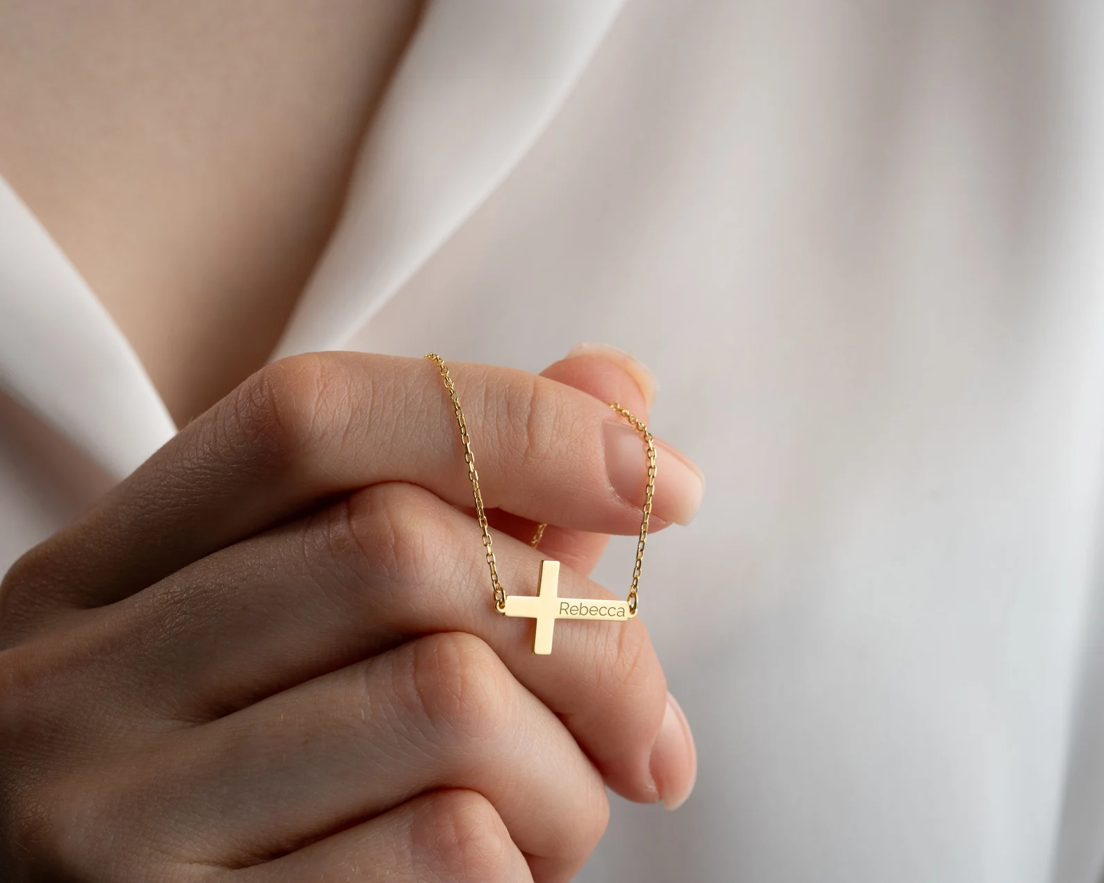 Hand-engraving custom scripture onto Ahava gold jewelry